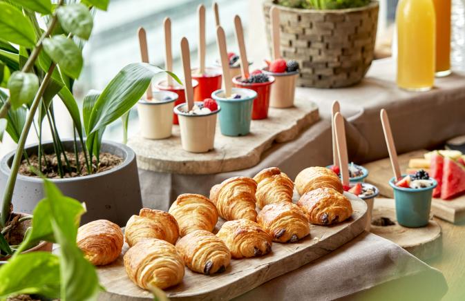 breakfast display with croissants and parfaits