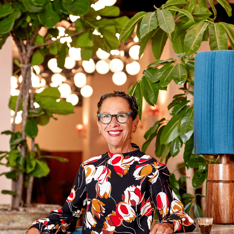 Nancy Silverton sitting on a chair posing for a photograph