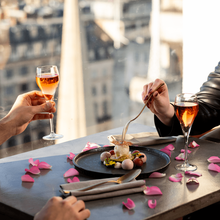 people enjoying a valentine's date dessert and drinking champagne
