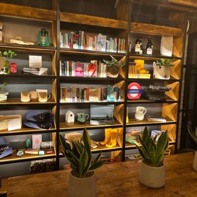 A wall of shelves with books on the shelves