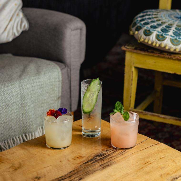 3 cocktails on a wood table