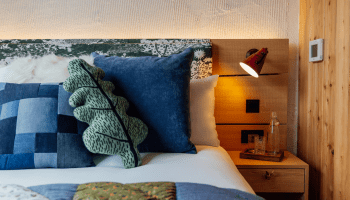 Super king bed with quilt and leaf pillow