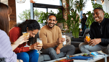 A group of friends laughing together at Madera
