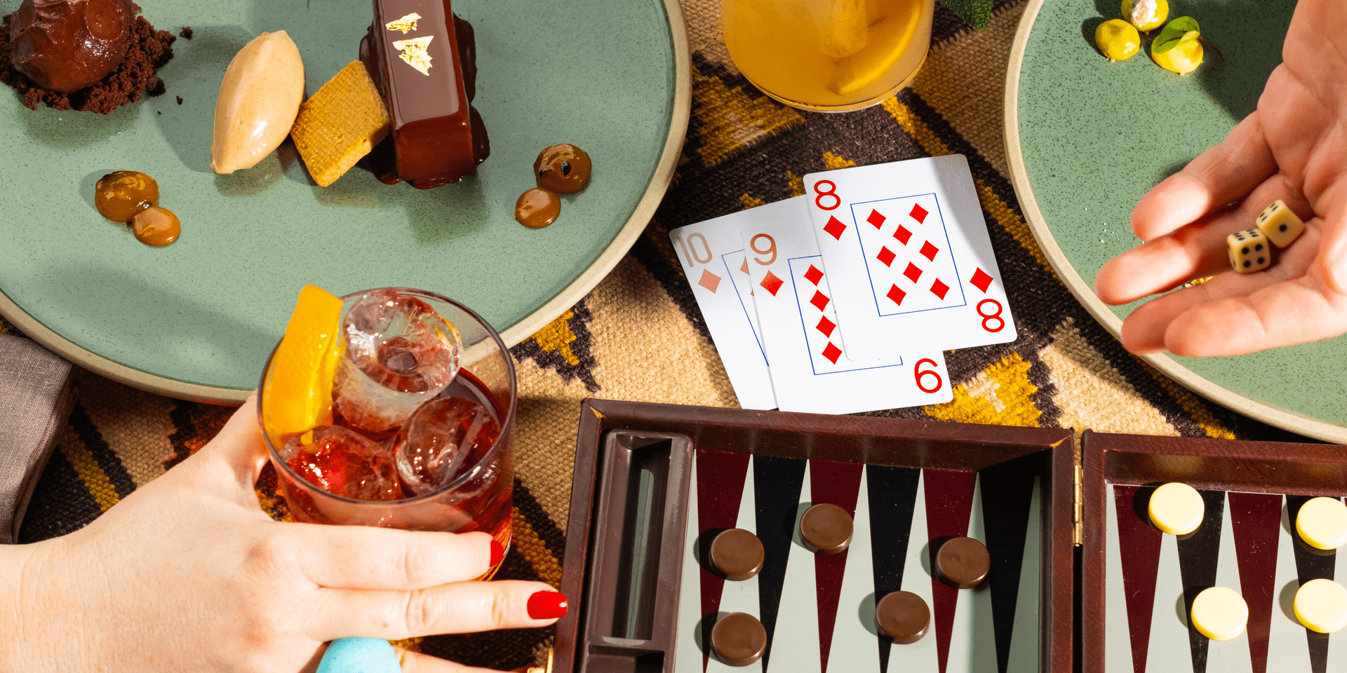 People playing card games and enjoying food